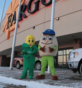Corn and Soybean mascots in front of the Fargodome