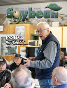 Cover of the June 2026 North Dakota Soybean Grower Magazine featuring a farmer speaking at a Producer Shop Talk event